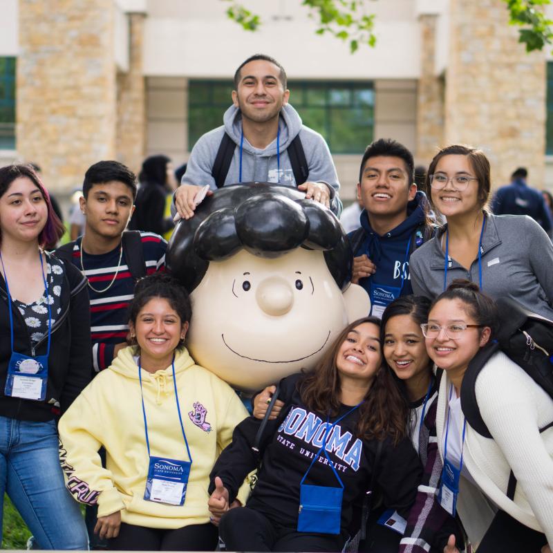 Group of students with Lucy statue 