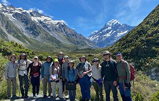 students in front of mountains