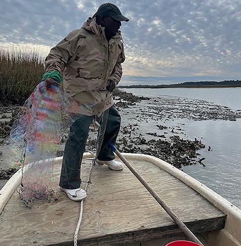 Man casts fishing net